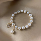 Pulsera con Medallón en Oro Blanco, Margarita y Girasol