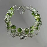 Pulsera retro con mariposa de plata y cuentas verdes
